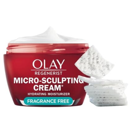 anti aging skincare Luxury anti-aging moisturizer jar opened beside a mirror and soft towel.