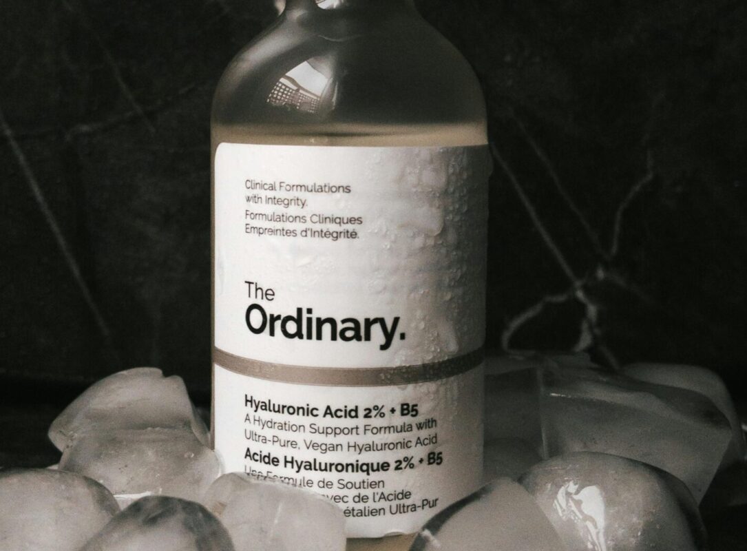 hyaluronic acid serum benefits. Woman applying hyaluronic acid serum to her face